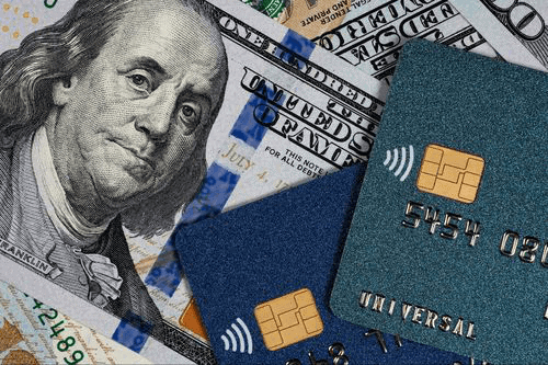 Credit card shown alongside a cash to represent two different borrowing options